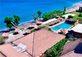 Гостиница Pasific Beach Cottages  Batu Layar